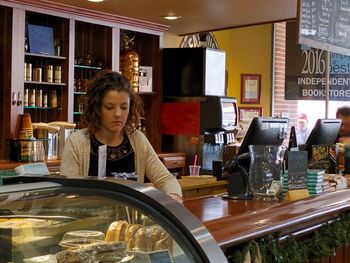 Portrait of woman sitting at restaurant table