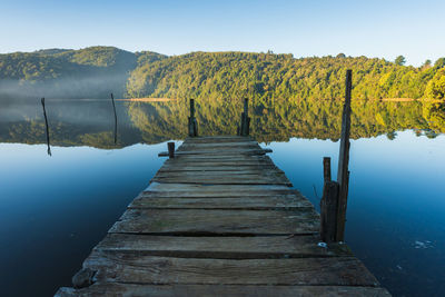 Jetty over calm lake