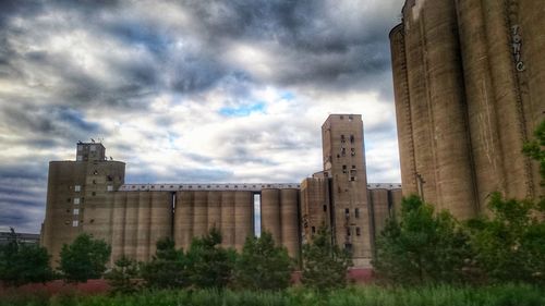 Old building against cloudy sky