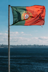 Low angle view of flag against sky