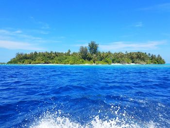 Scenic view of sea against blue sky