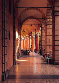 Rear view of man walking in tunnel