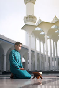 Man reading koran in mosque