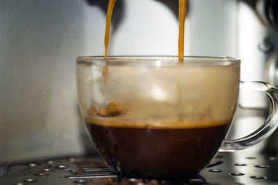 Close-up of coffee cup on table