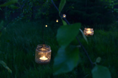 Illuminated upcycled glass jars handcrafted hanging lanterns with tea candles