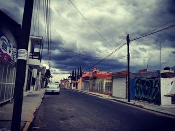 Cars on road against sky