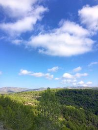 Scenic view of landscape against cloudy sky