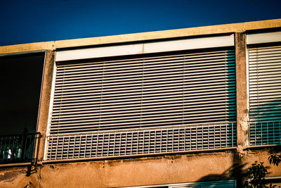 Low angle view of building against blue sky