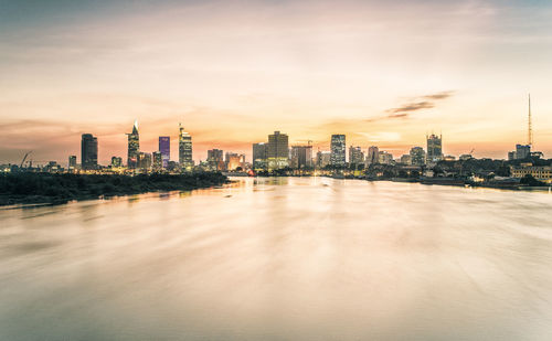 View of cityscape against sky during sunset