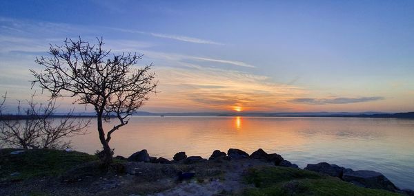 Scenic view of sea against sky during sunset