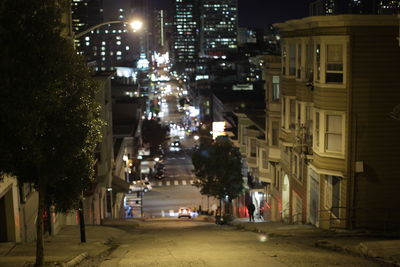 Buildings in city at night