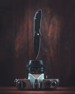 Close-up of camera on table