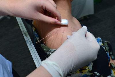 Midsection of woman holding hands