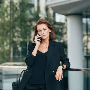 Young businesswoman talking on phone