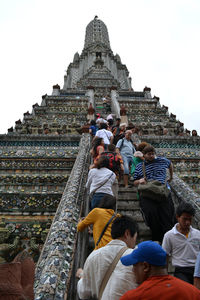 Group of people in temple against building