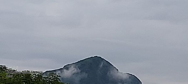 Low angle view of snow covered land against sky