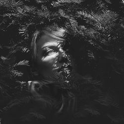 Portrait of woman amidst trees