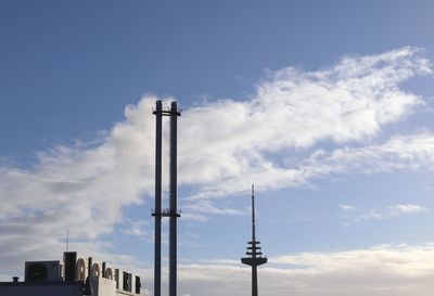 Low angle view of smoke stack against sky