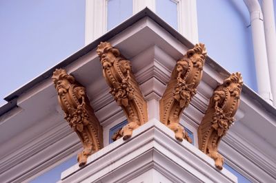 Low angle view of ornate building against sky