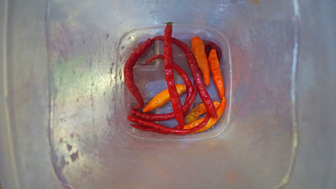 HIGH ANGLE VIEW OF RED CHILI PEPPER ON CONTAINER