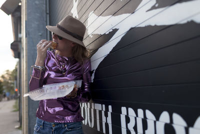 Young woman enjoying fast food