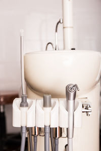 Close-up of faucet in bathroom