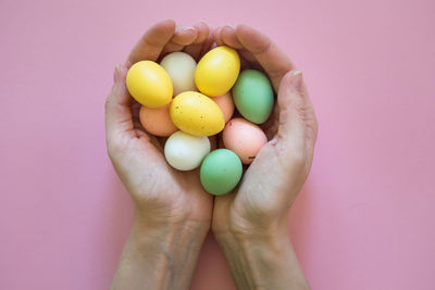 Close-up of hand holding eggs