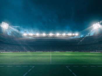 View of soccer field against sky at night