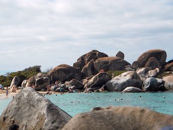 Scenic view of sea and rocks against sky