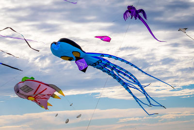 Low angle view of kite flying against sky