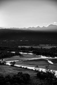 Scenic view of landscape and mountains against sky