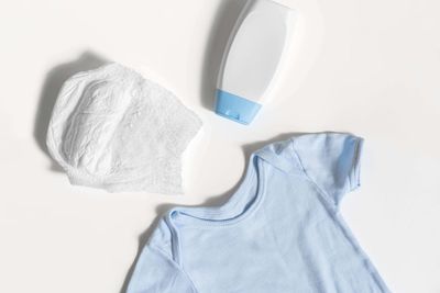 High angle view of hat on sofa against white background