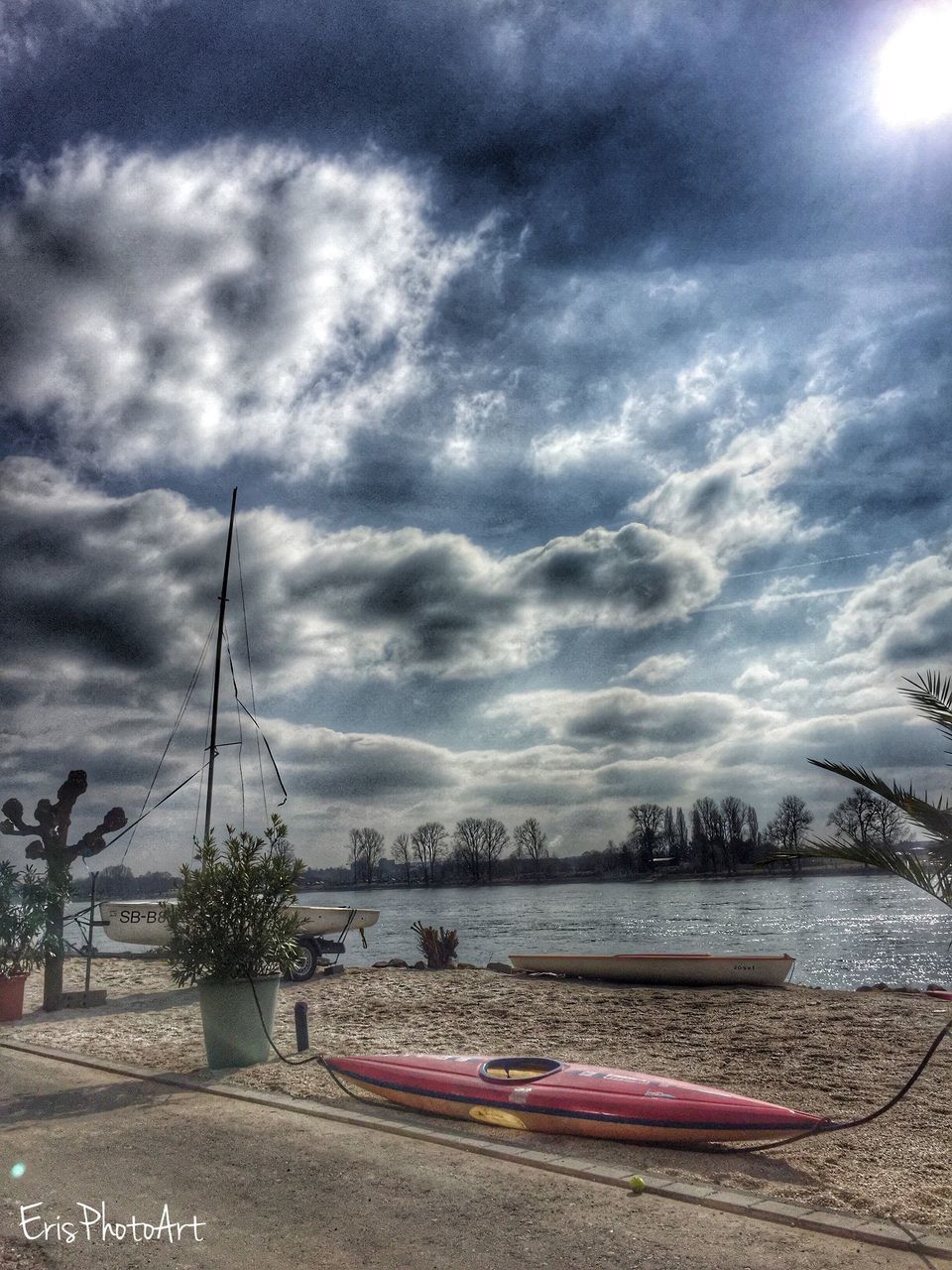 sky, cloud - sky, cloudy, water, weather, transportation, tranquility, nature, beauty in nature, road, scenics, overcast, river, tree, tranquil scene, cloud, mode of transport, street light, car, sea