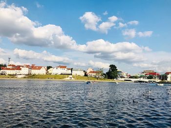 Buildings in town against sky