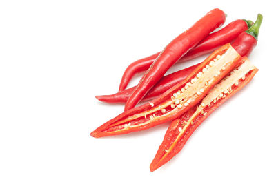 Close-up of red chili pepper against white background