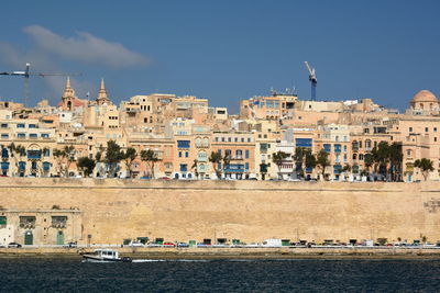 Buildings in city against sky