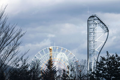 Low angle view of ferris wheel against sky