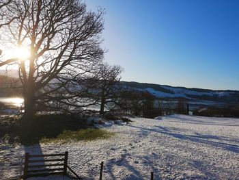 Scenic view of snow covered landscape against sky