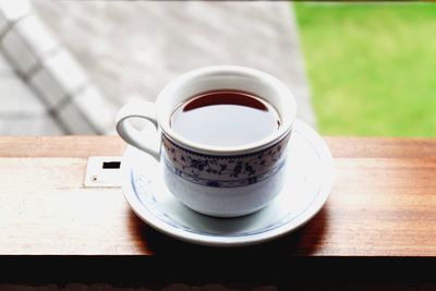 Close-up of coffee cup on table