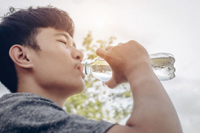 Close-up portrait of boy drinking drink