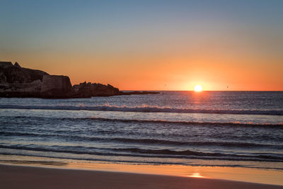 Scenic view of beach during sunset