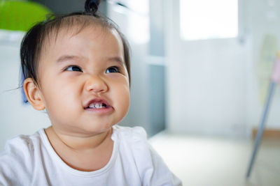 Portrait of cute baby girl at home