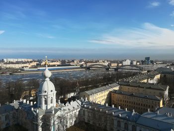 Panoramic view of buildings in city against sky