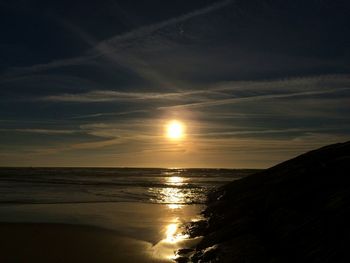 Scenic view of sea against sky at sunset