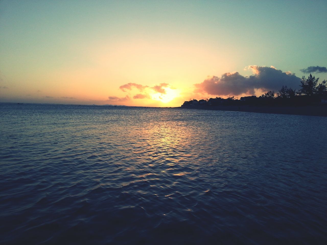 sunset, water, sea, scenics, tranquil scene, tranquility, beauty in nature, sky, waterfront, horizon over water, rippled, idyllic, nature, orange color, silhouette, reflection, seascape, outdoors, sun, calm