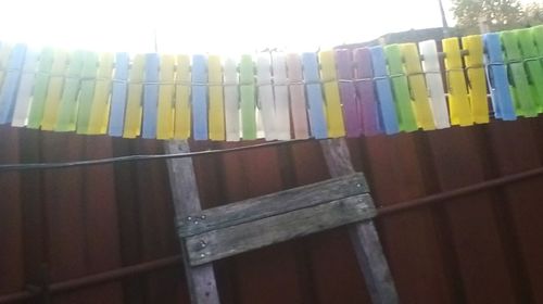 Low angle view of clothes drying against the sky