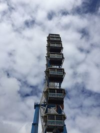 Low angle view of building against cloudy sky