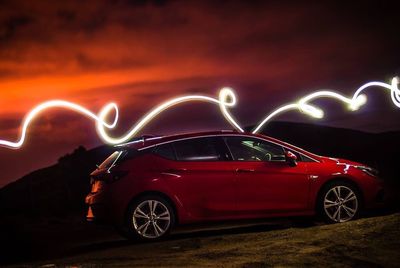 Vintage car on road at night