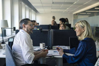 Two professionals discussing in office