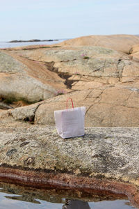 Close-up of rock formation against the sea 